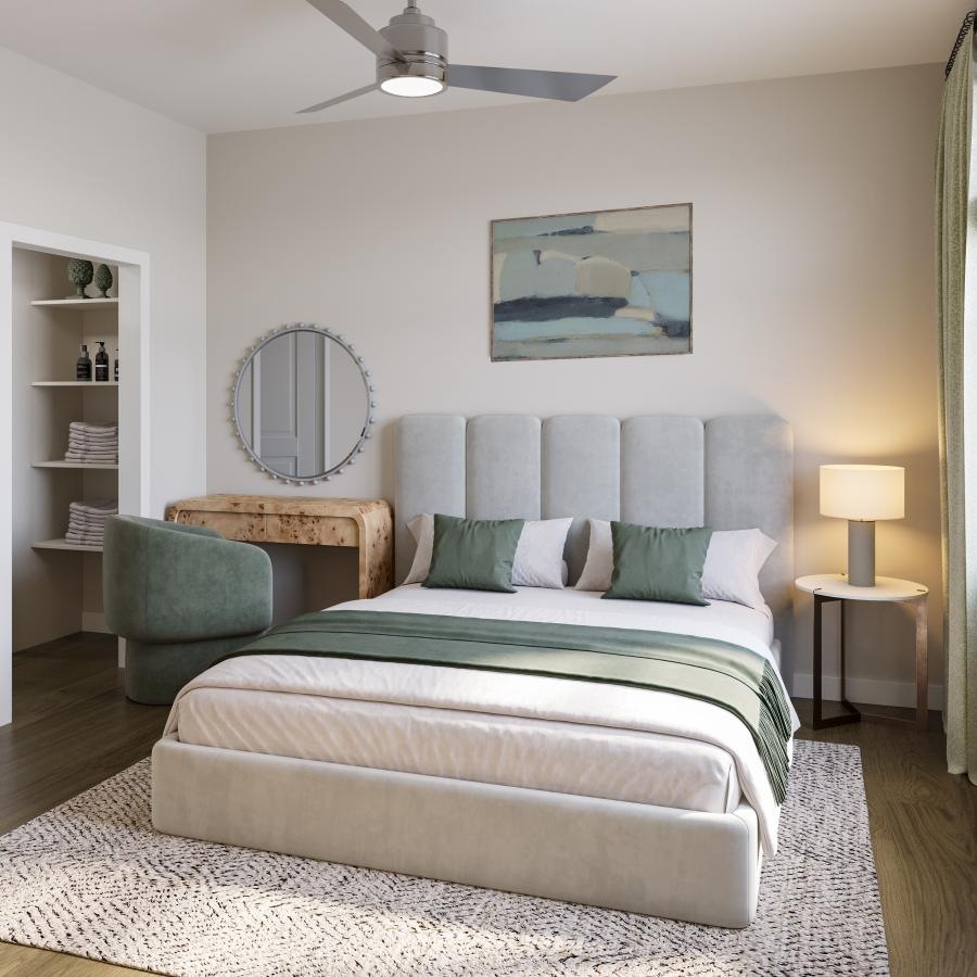 a bedroom with a bed and a mirror