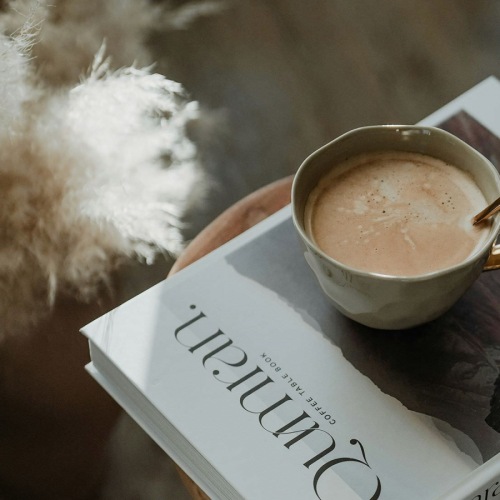 a cup of coffee on a book