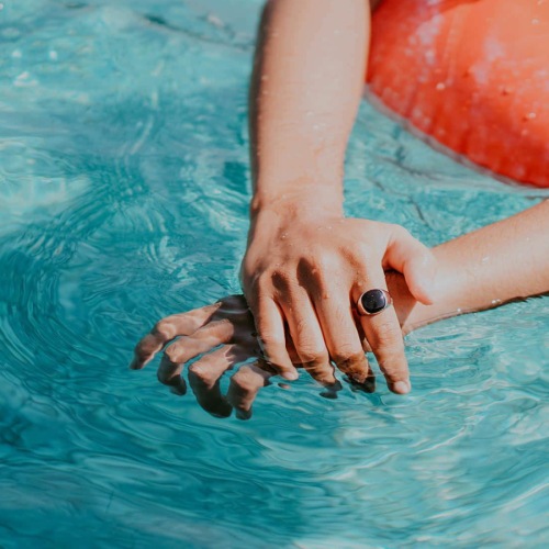 a person on a floaty in a pool