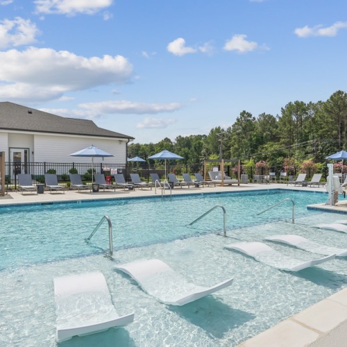 pool with lounge chairs