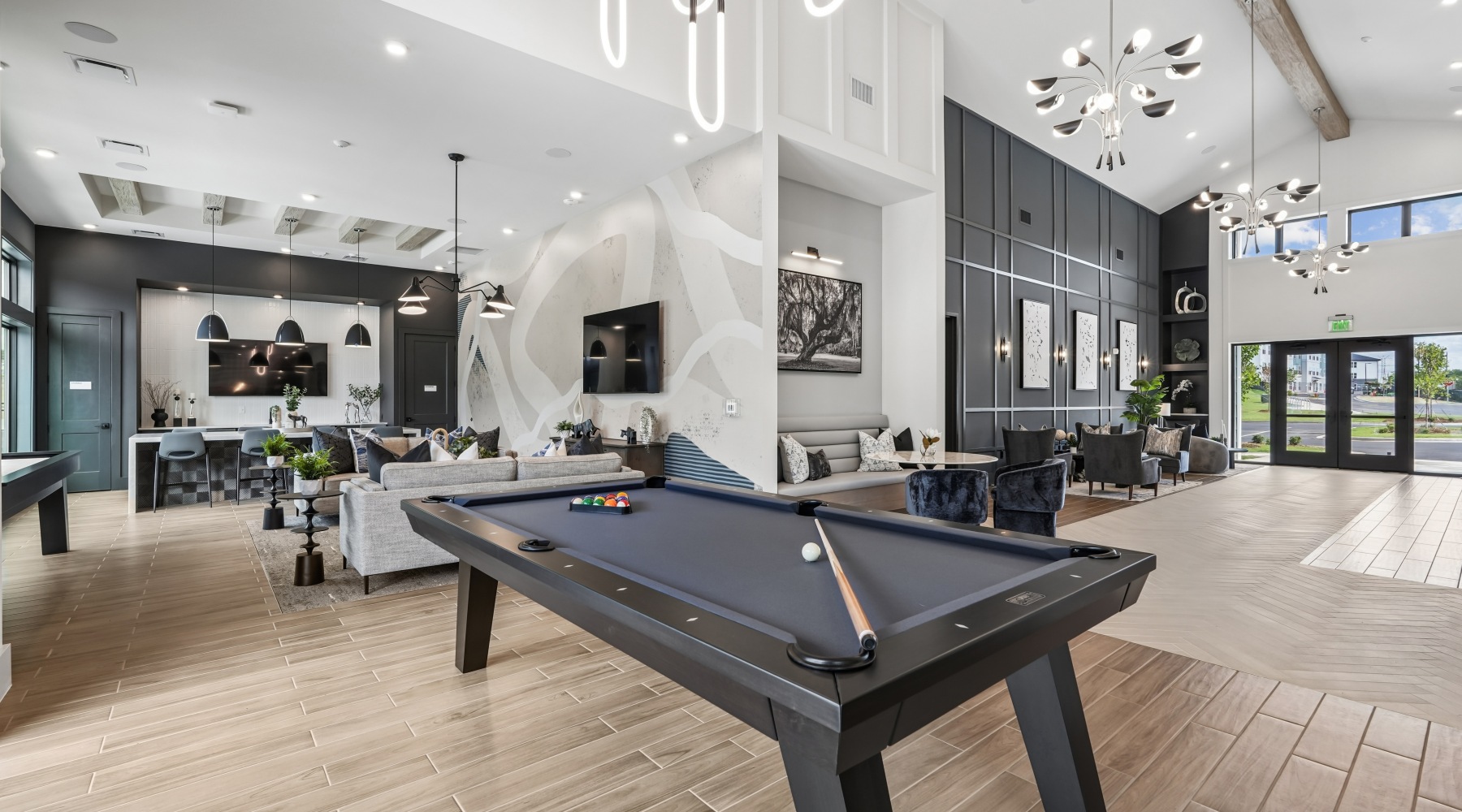 clubroom with pool table, hospitality bar, and more