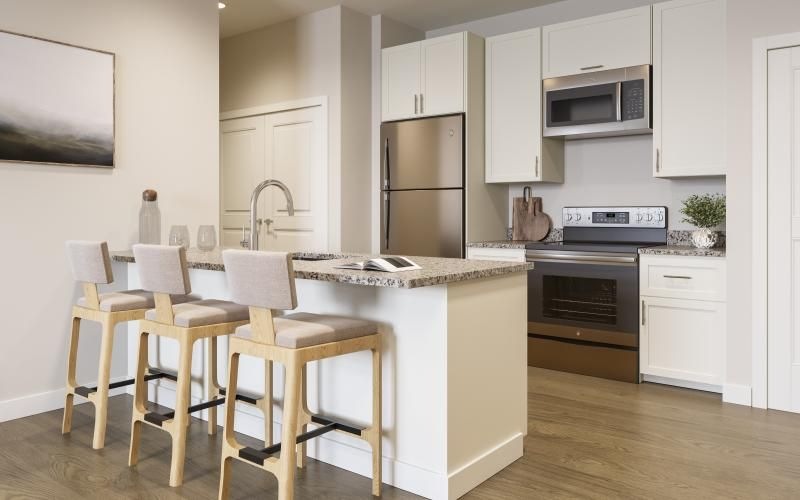 a kitchen with white cabinets